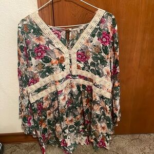 brand is Jodifl, size is a large, and has beautiful colored flowers.